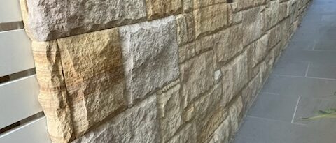 Cladding on brick wall